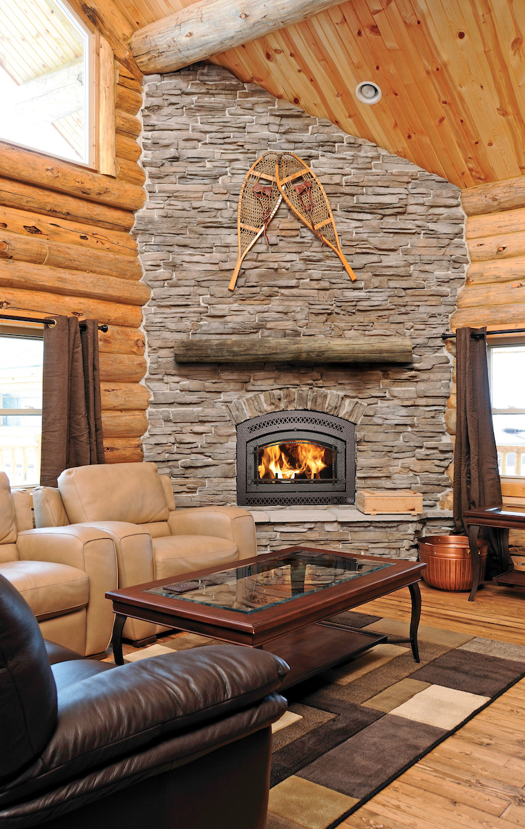 cozy, large, rock fireplace in a cabin
